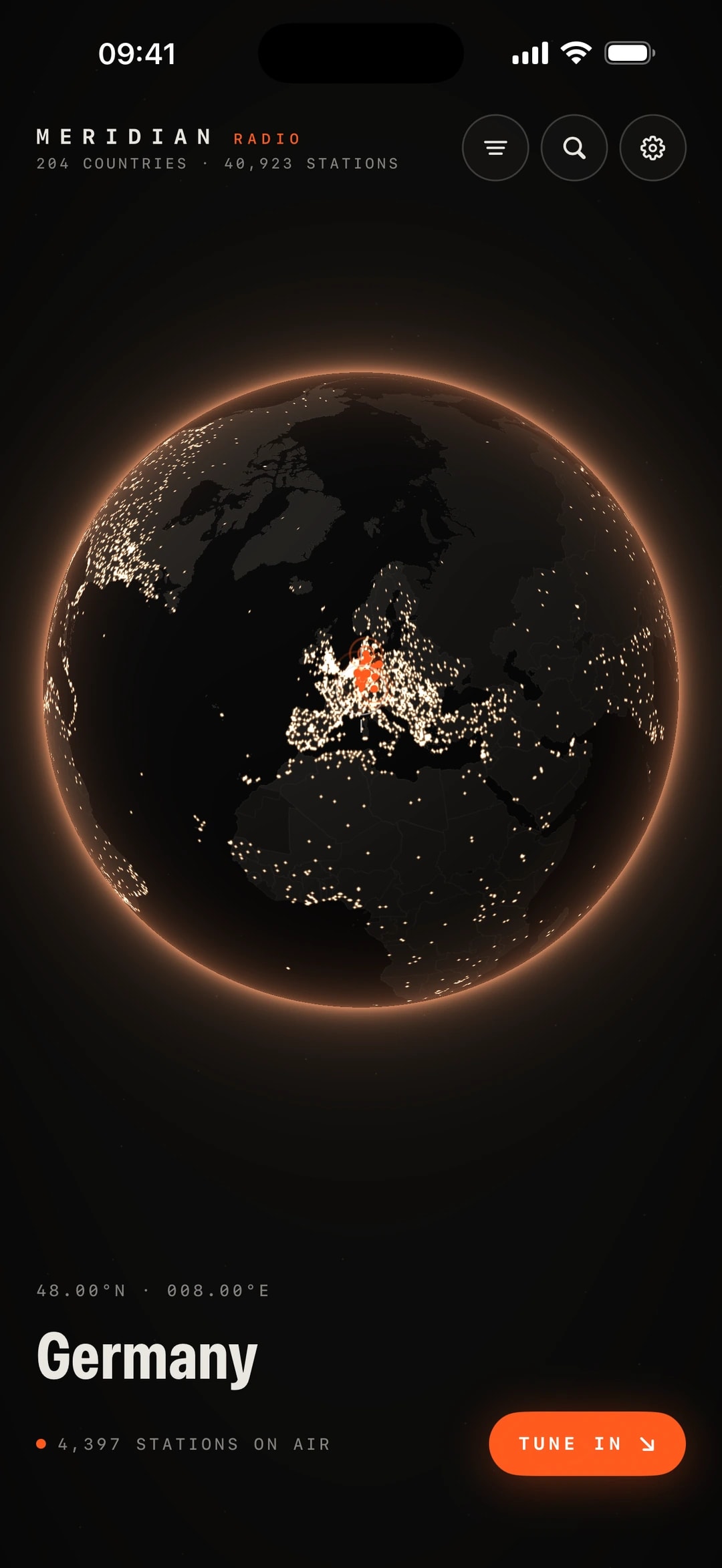 Meridian Radio orbit view on iPhone: a dark globe lit only by station dots, Germany under the reticle with 4,397 stations on air and a Tune in button